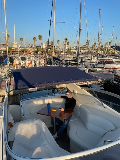 Daniel on a boat at a marina